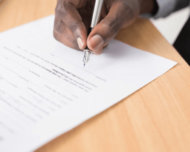 An accredited translator signing a certified translation certificate in New York